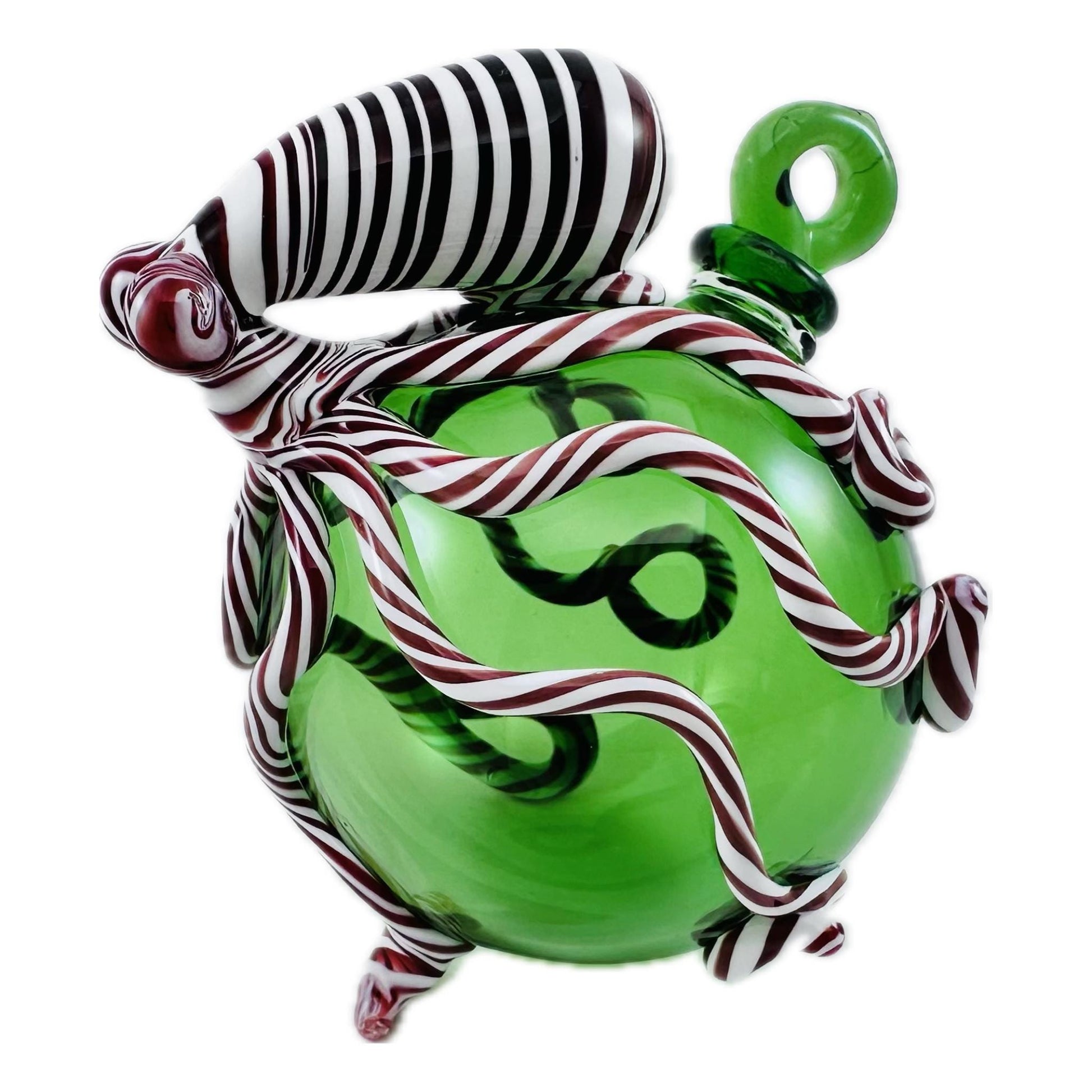 Green glass ornament with candy cane design on a white background