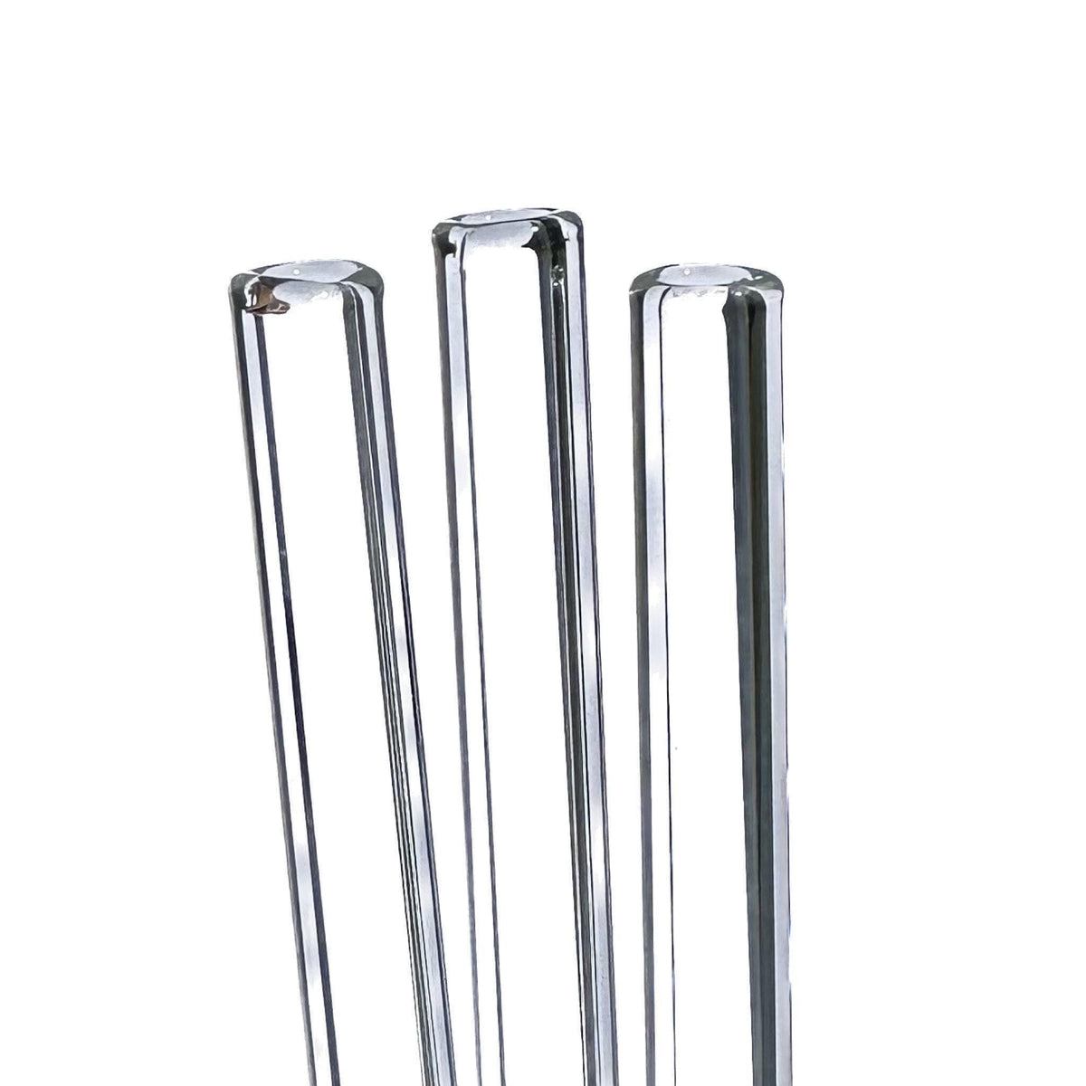 Three clear glass tubes on a white background