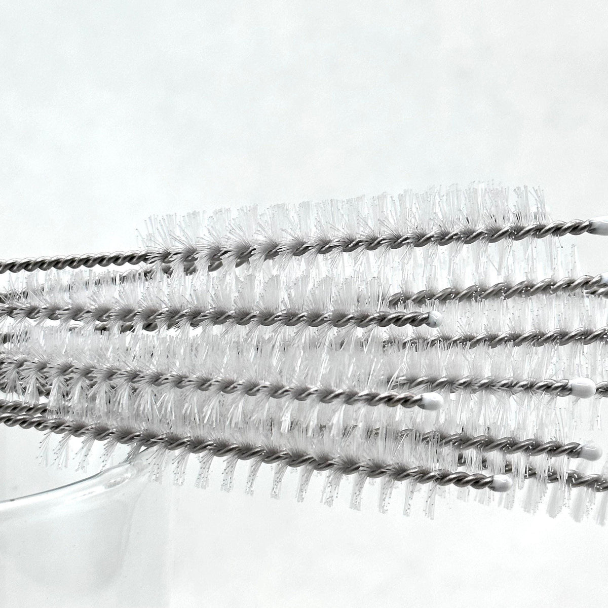 Straw cleaning brushes with bristle heads on a white background